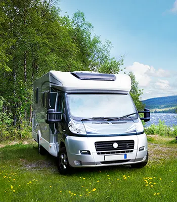 Motor home in a beautifully landscaped countryside.